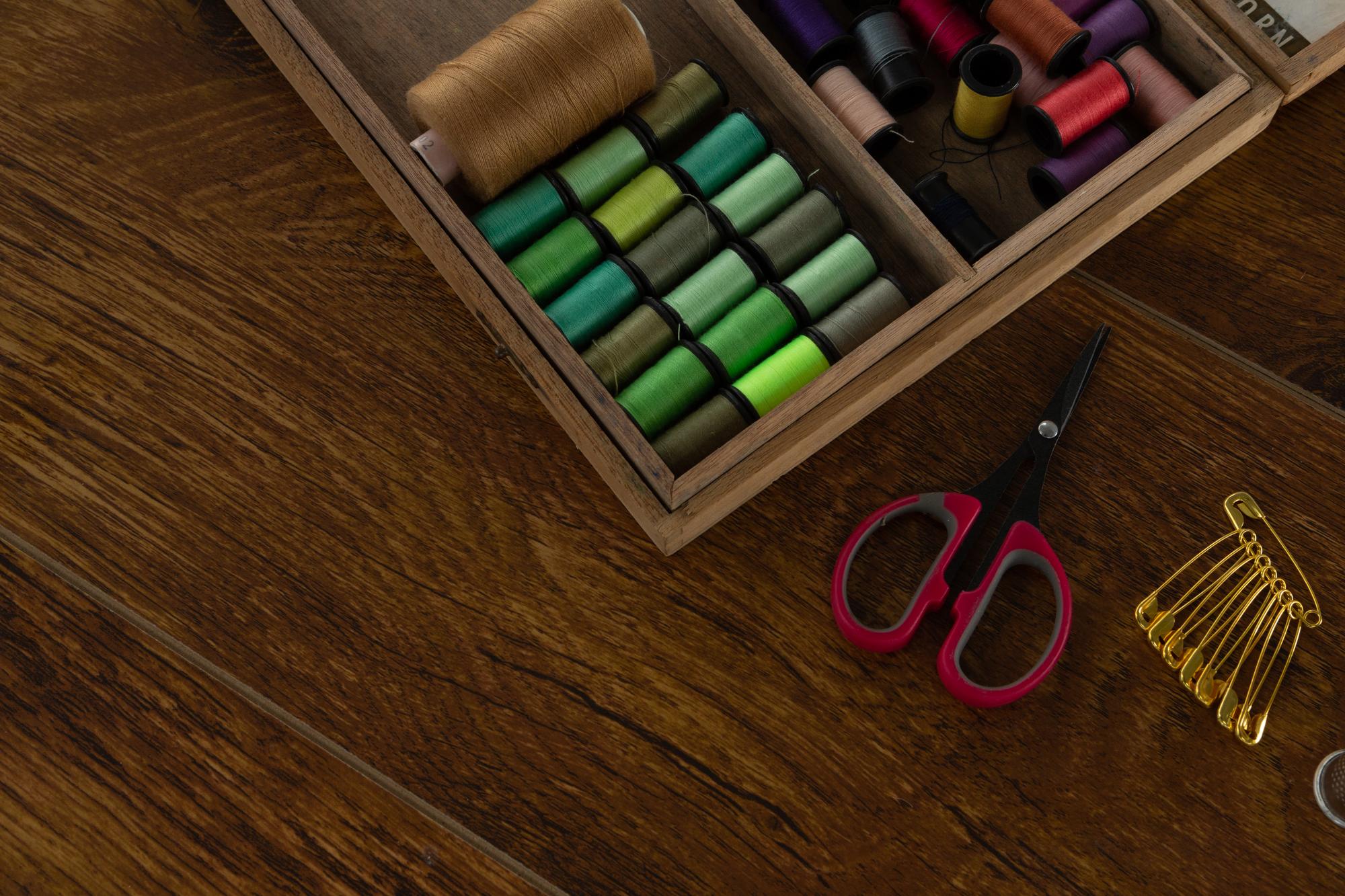 Assorted embroidery tools on table